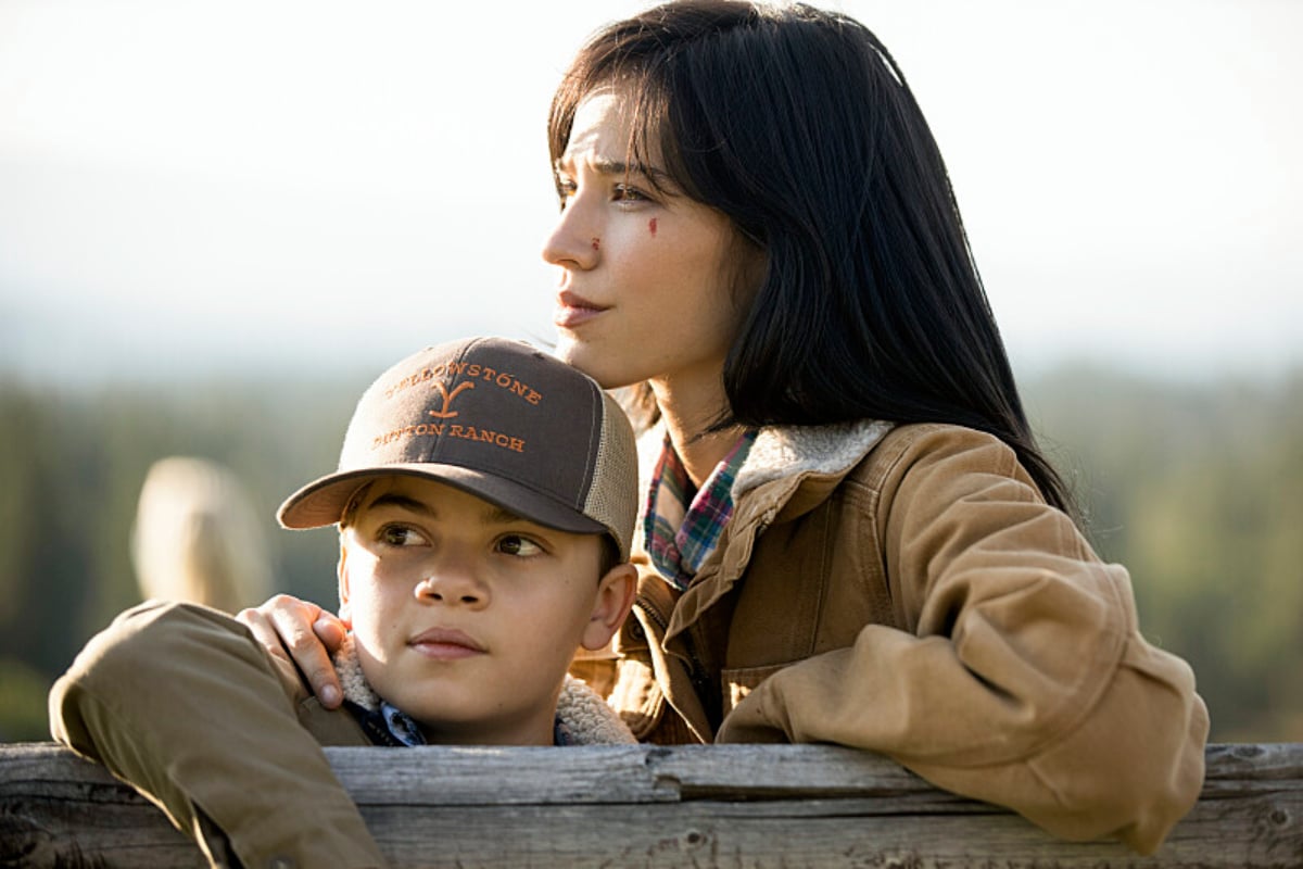 In Yellowstone, Monica stands with her son Tate. 
