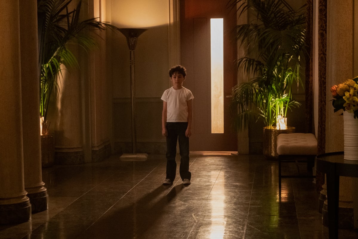 There are several loose ends going into You Season 4. Young Joe Goldberg stands in an enormous entryway.