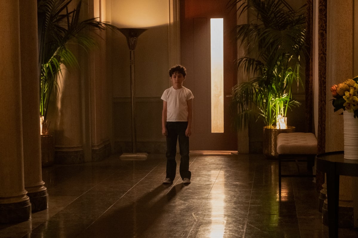 There are several loose ends going into You Season 4. Young Joe Goldberg stands in an enormous entryway. 