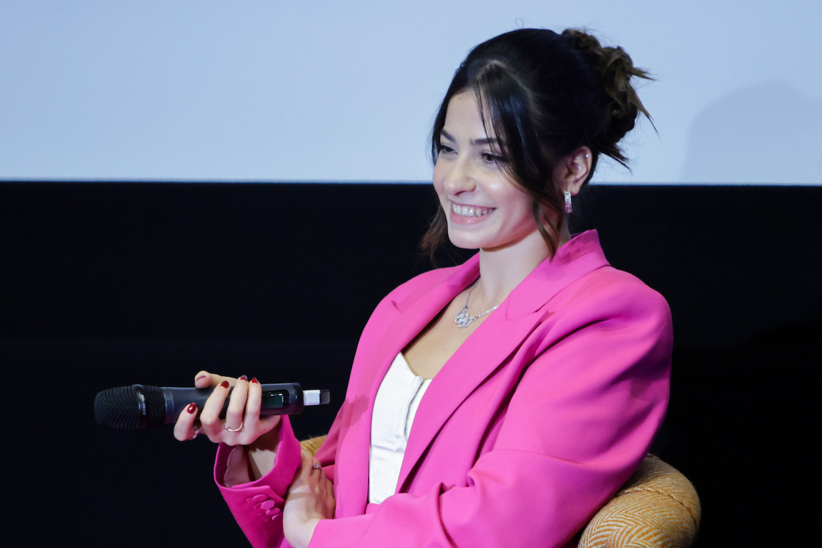 Yusra Mardini speaks on stage during the Q&A at the screening of 'The Swimmers'
