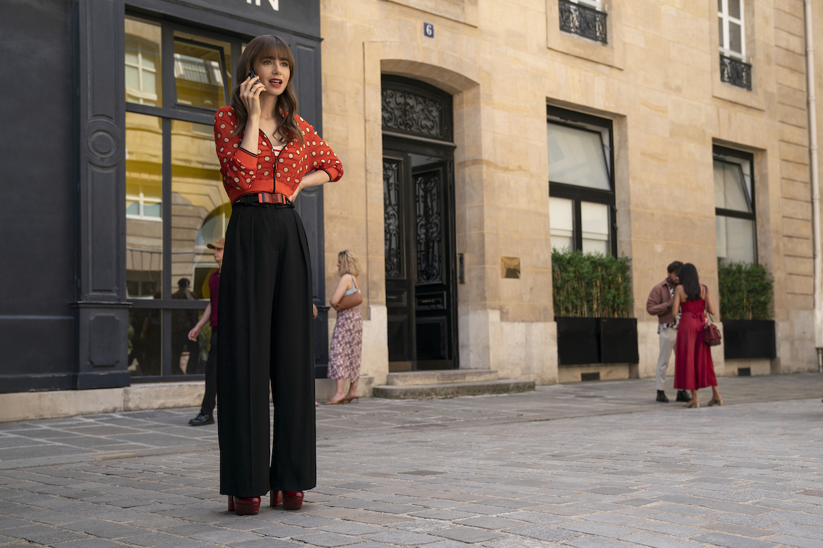 Lily Collins in front of the Galerie Patrick Fourtin where 'Emily in Paris' Season 3 filmed