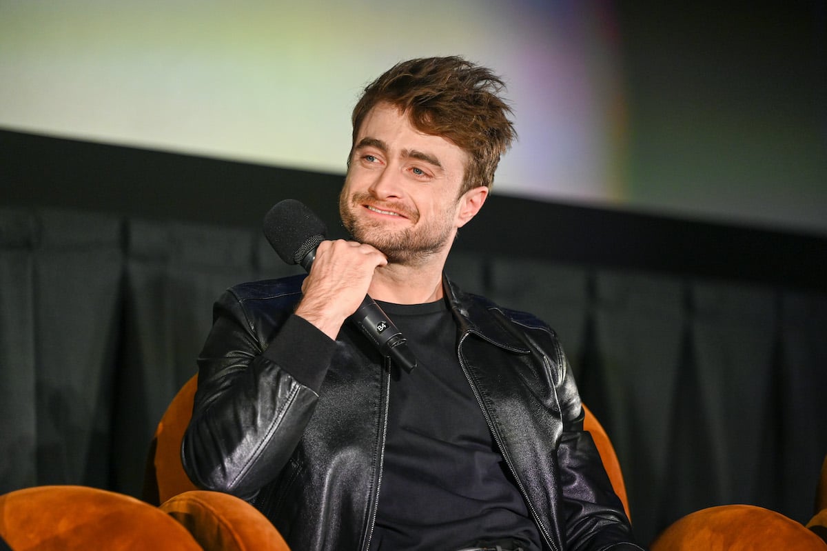 'Harry Potter' star Daniel Radcliffe smiles while holding a microphone