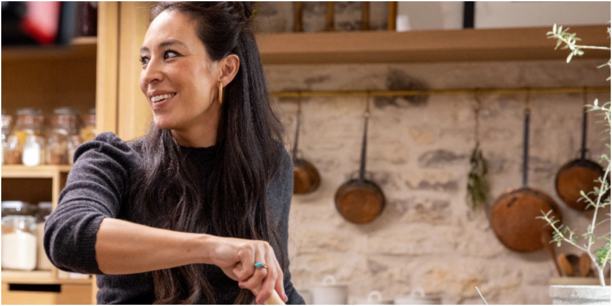 Joanna Gaines cooks in the kitchen of her discovery+ show.