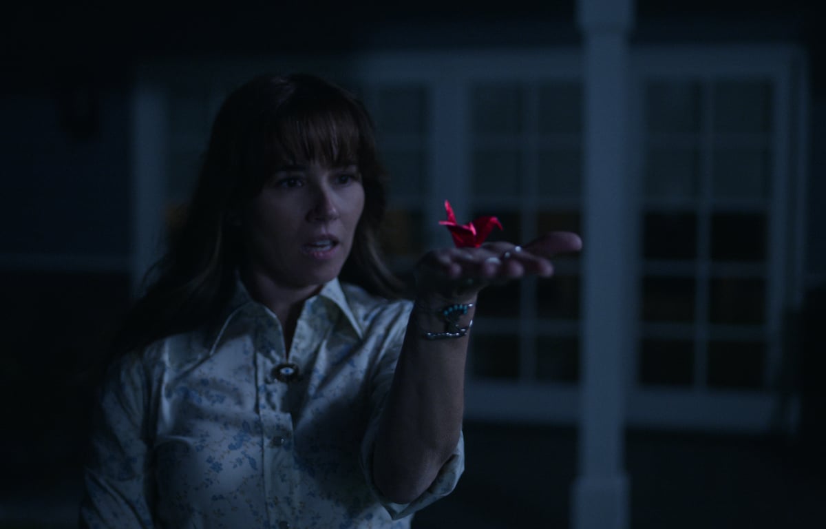 Judy (Linda Cardellini) reaches out to catch a crane in the final season of 'Dead to Me'