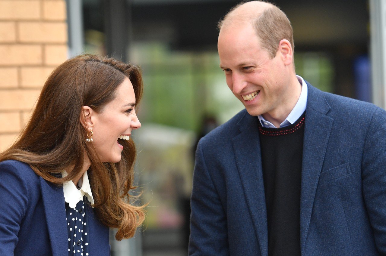 Kate Middleton and Prince William smile together. 