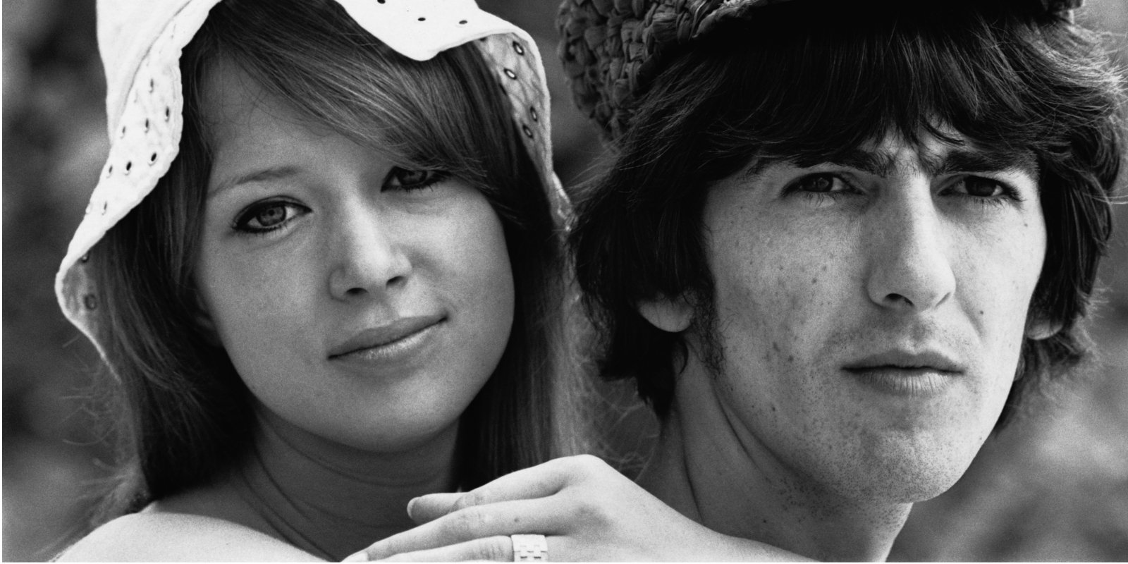 Pattie Boyd and George Harrison pose for a photograph.