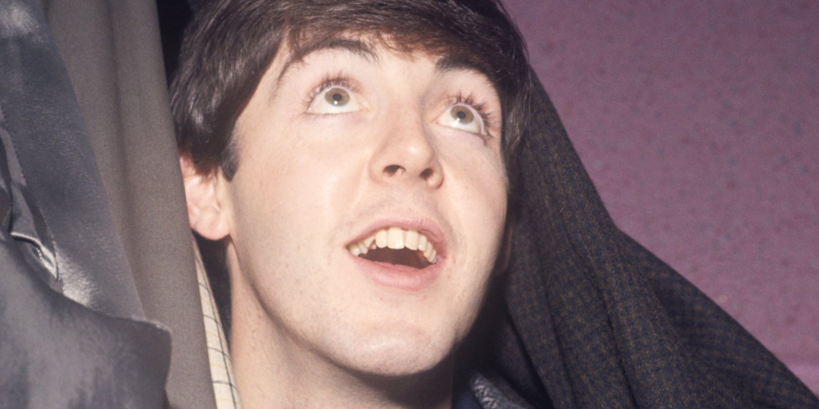 Paul McCartney looks up toward the sky, backstage in Manchester, England.