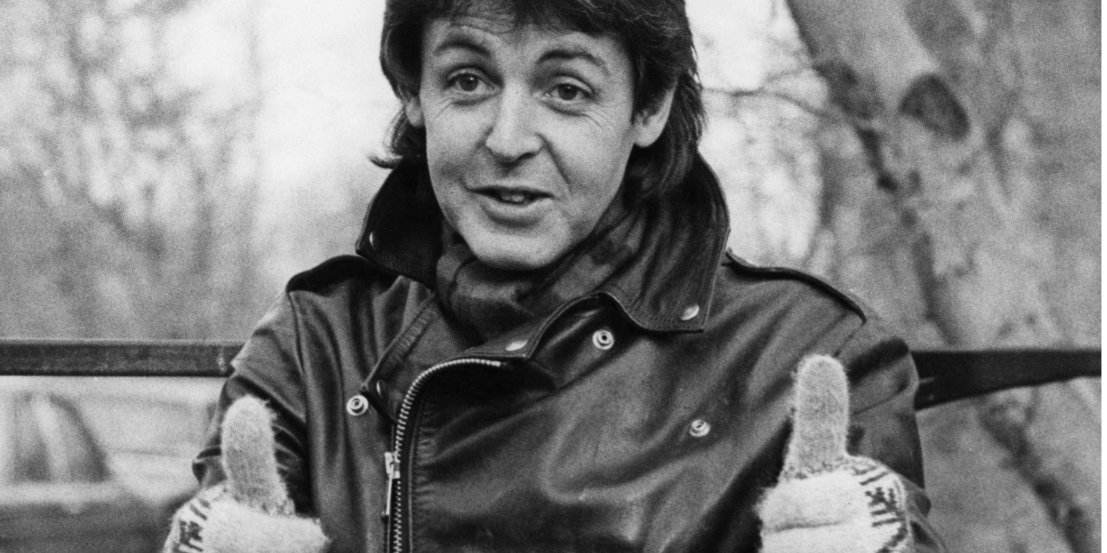 Paul McCartney gives a thumbs up to the press at his farmhouse near Rye, Sussex, after being deported from Japan for bringing drugs into the country on a concert tour with his group Wings, 28th January 1980.