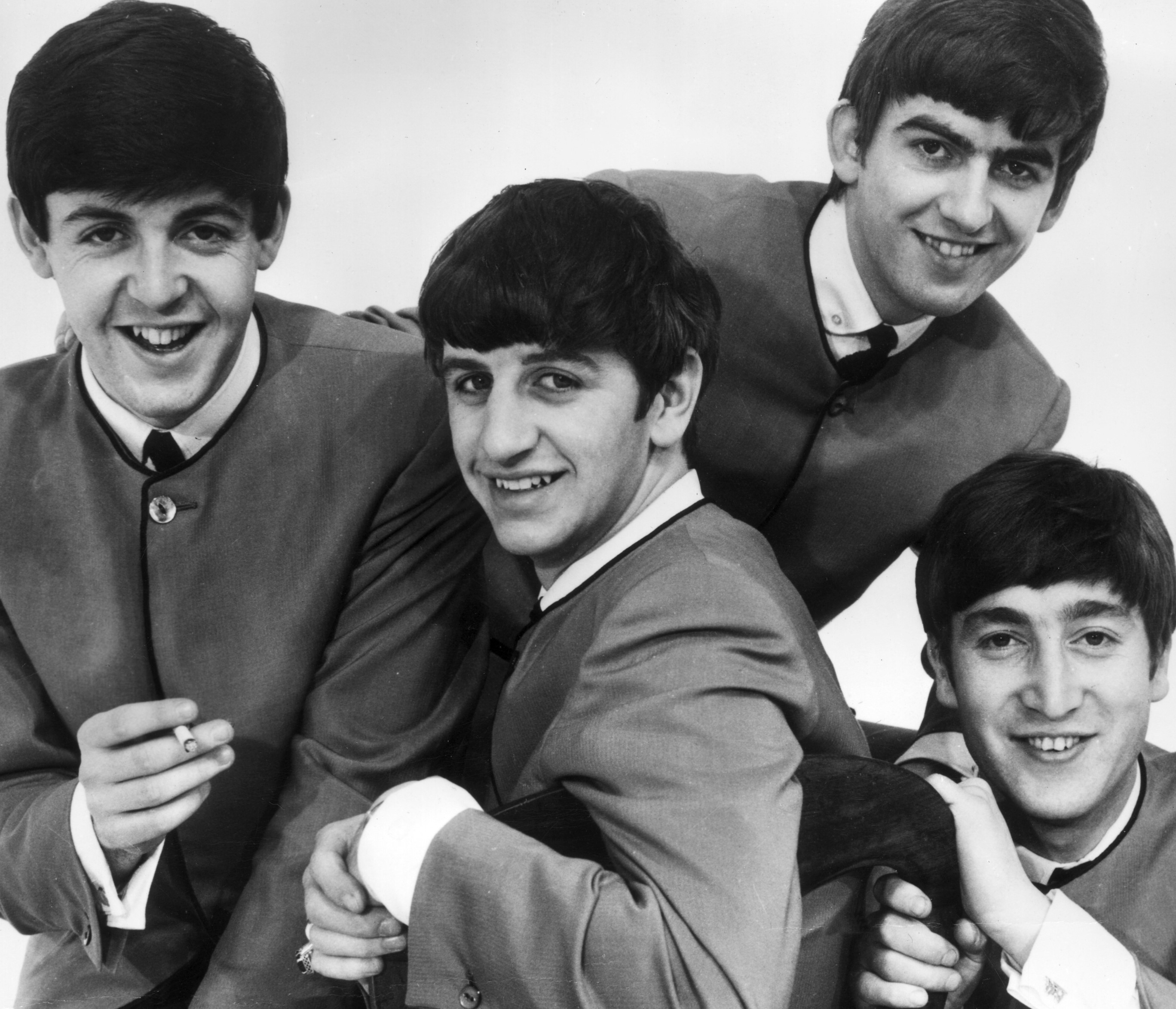 The Beatles with mop tops during the "I Want to Hold Your Hand" era