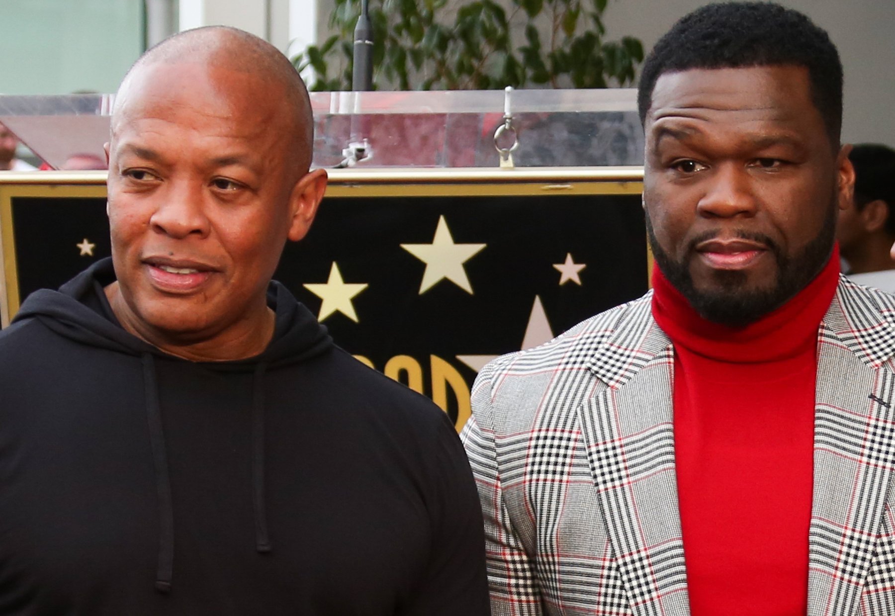 Dr. Dre and Curtis "50 Cent" Jackson posing for a photo together