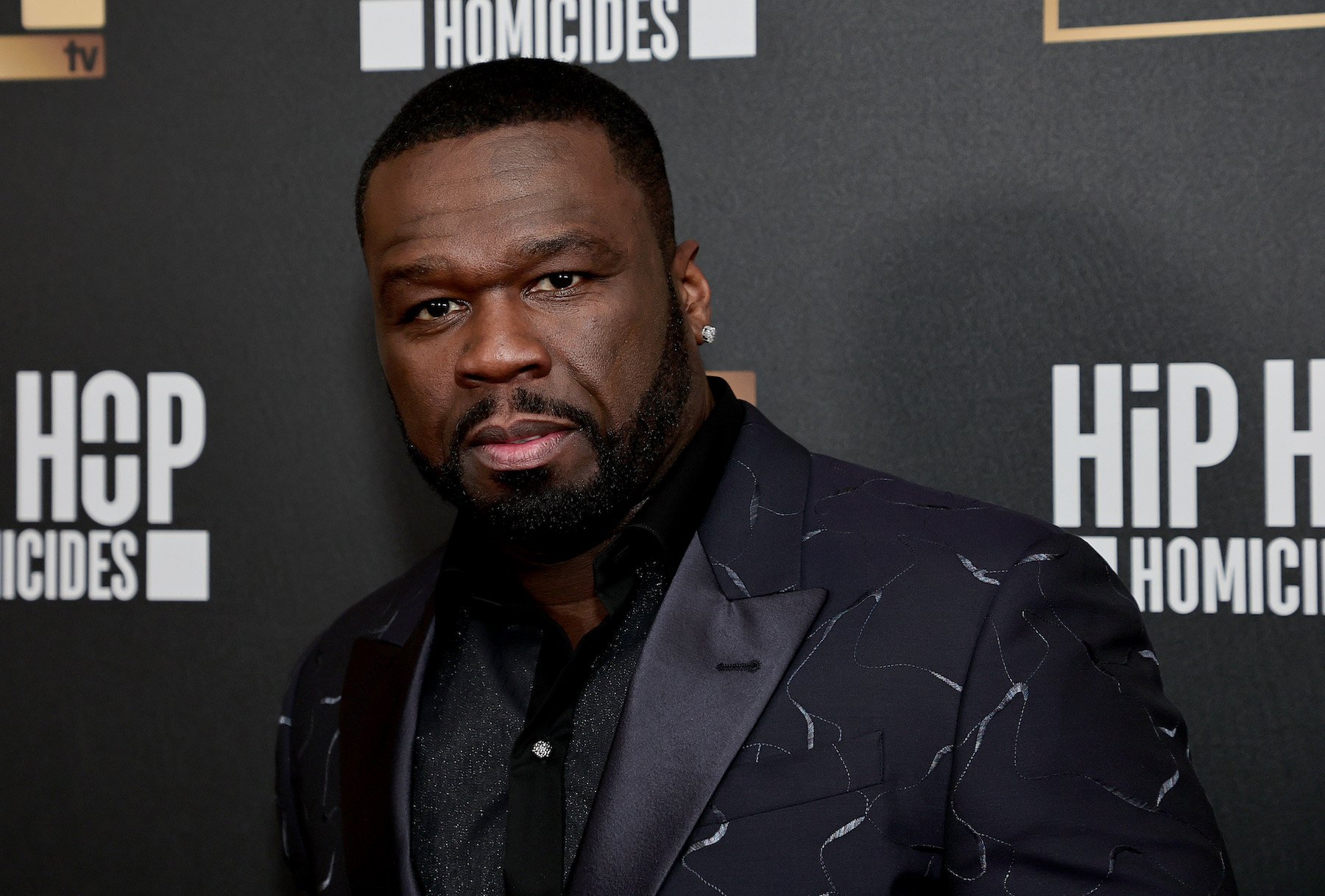 Curtis "50 Cent" Jackson, who teased new music in 2023, wearing a black suit