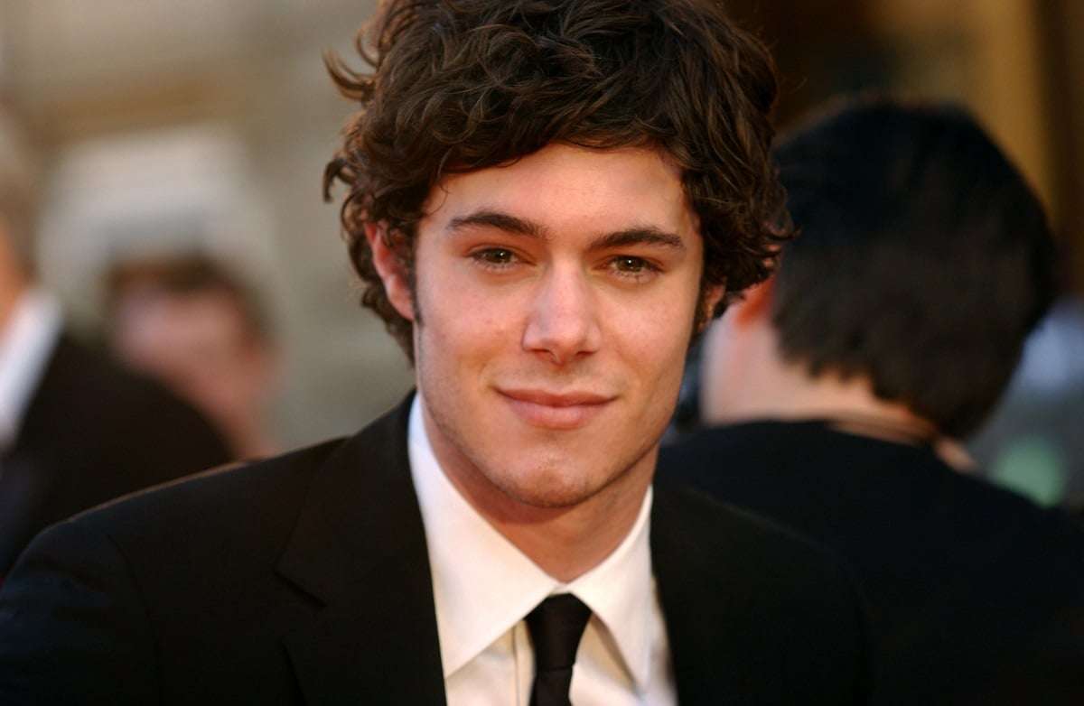 Adam Brody poses for a photo in a suit at the 30th Annual People's Choice Awards. Brody portrayed Dave Rygalski in 'Gilmore GIrls' before moving on to bigger roles.