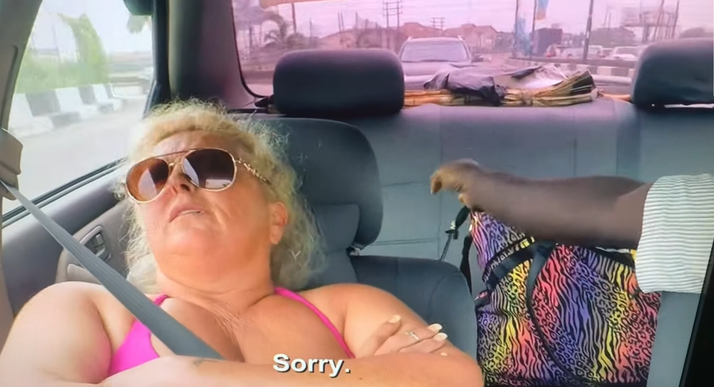 Angela Deem laying down in the passenger's seat of her husband Michael's car on '90 Day Fiancé' on TLC.