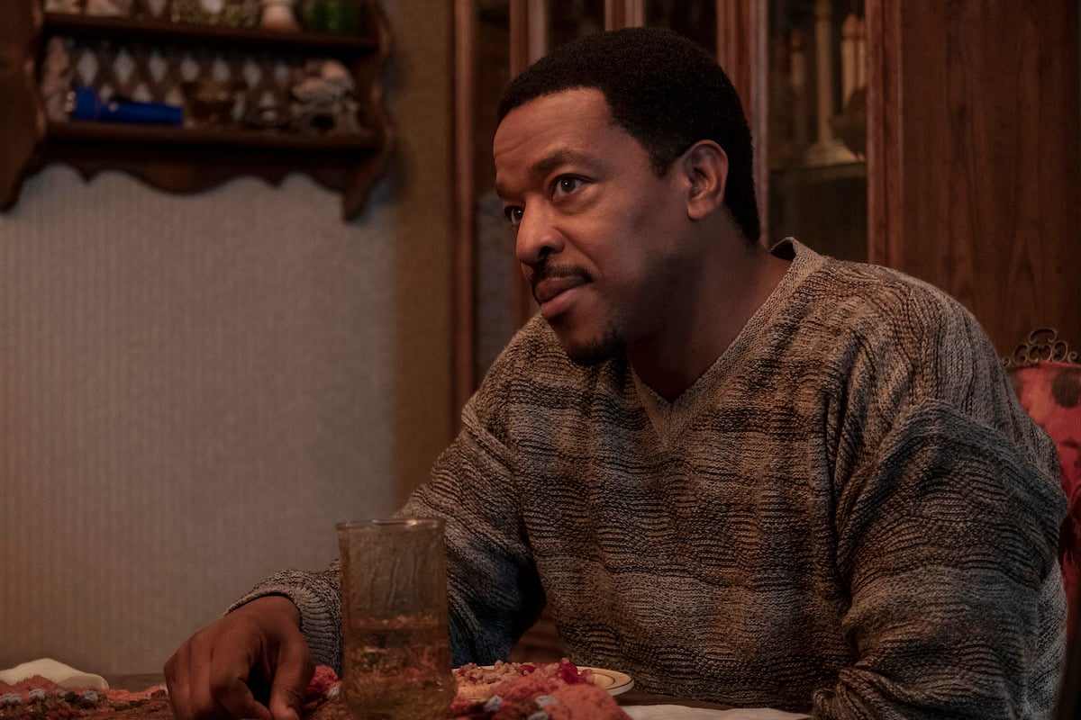 Russell Hornsby as Charles Flenory sitting at the dinner table in 'BMF'