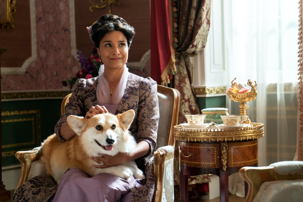 'Bridgerton' actor Shelley Conn as Mary Sharma holding Newton the corgi