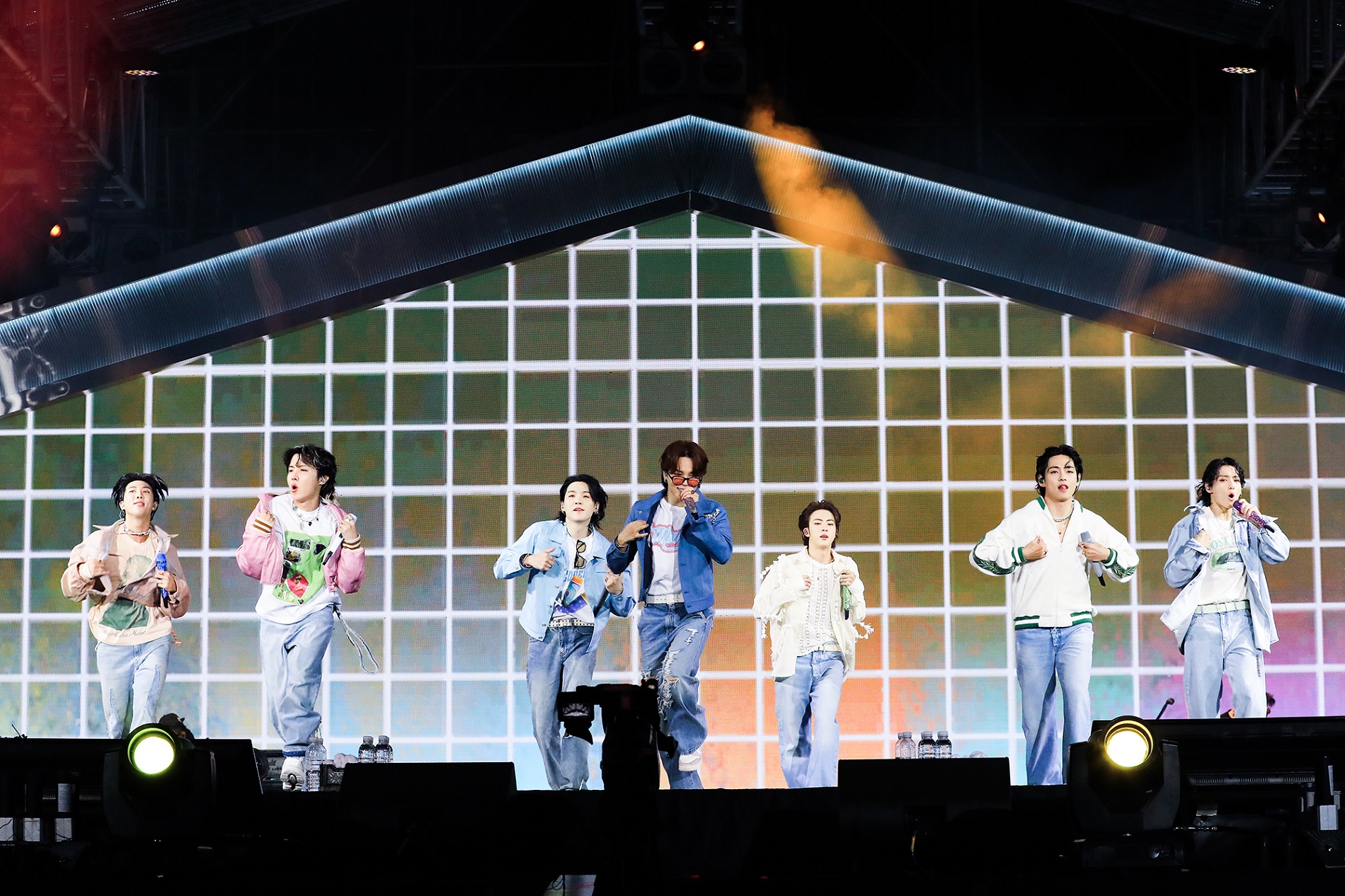 RM, J-Hope, Suga, Jimin, Jin, V, and Jungkook of BTS perform on stage