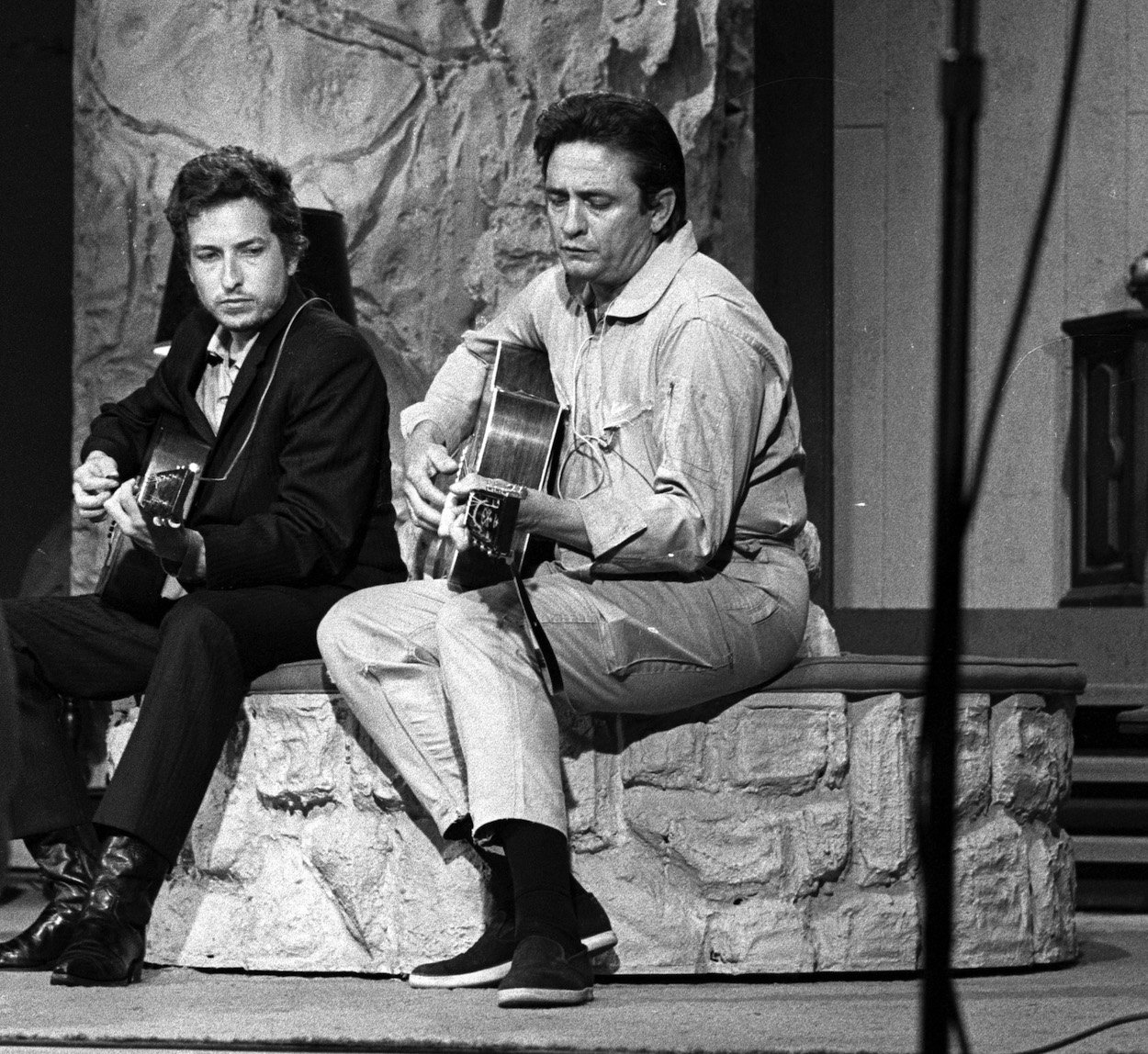 Bob Dylan (left) and Johnny Cash share a moment off camera in 1969 during Dylan's appearance on Cash's TV show.