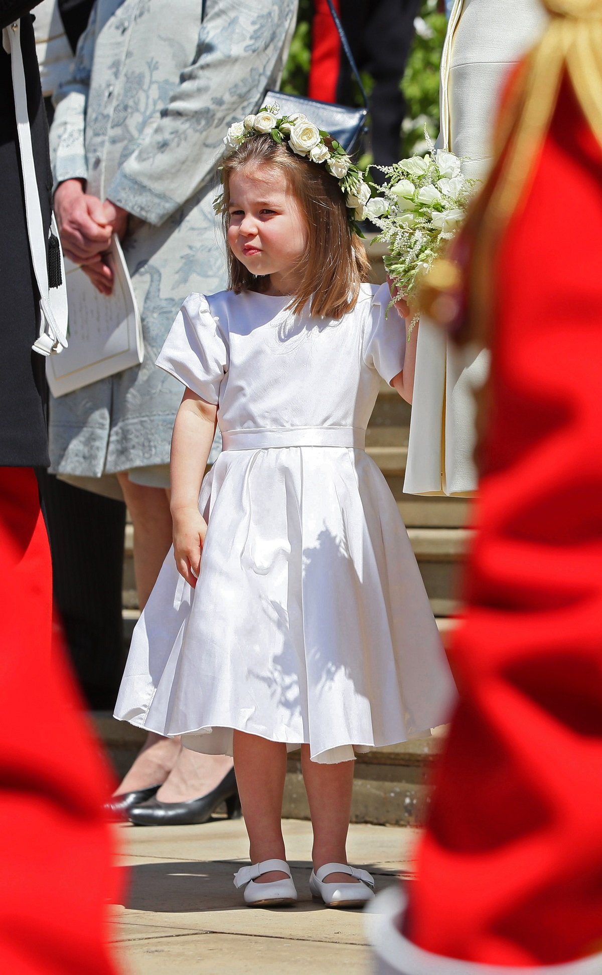 Bridesmaid Princess Charlotte looks on after attending the wedding ceremony of Prince Harry and Meghan Markle