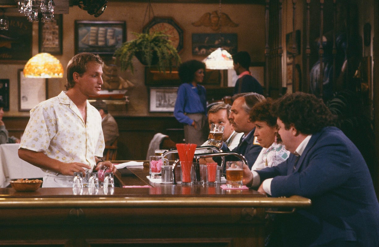 'Cheers': Bartender Woody serves Cliff and Norm while Carla takes orders