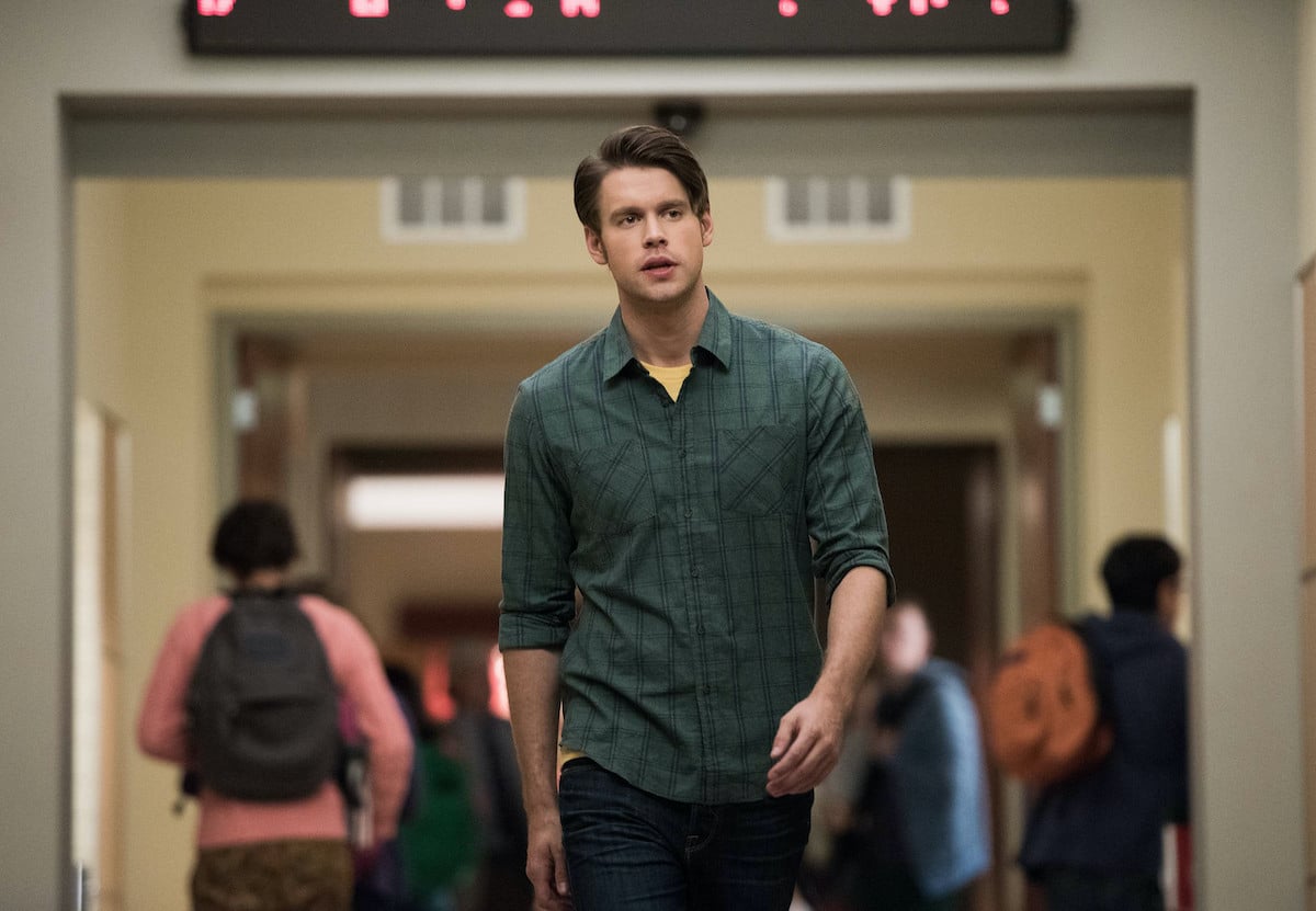 'Glee' actor Chord Overstreet as Sam Evans walking down a school hallway