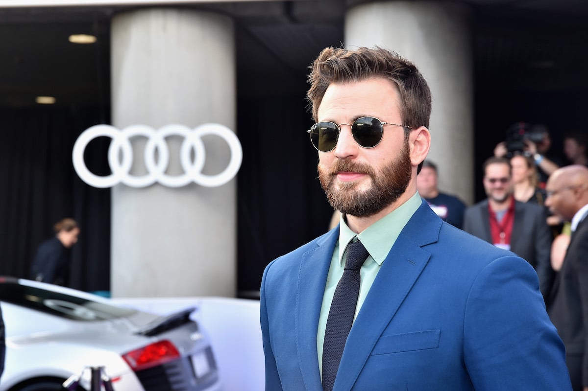 Chris Evans poses in front of the Audi logo at the premiere of "Avengers: Endgame"