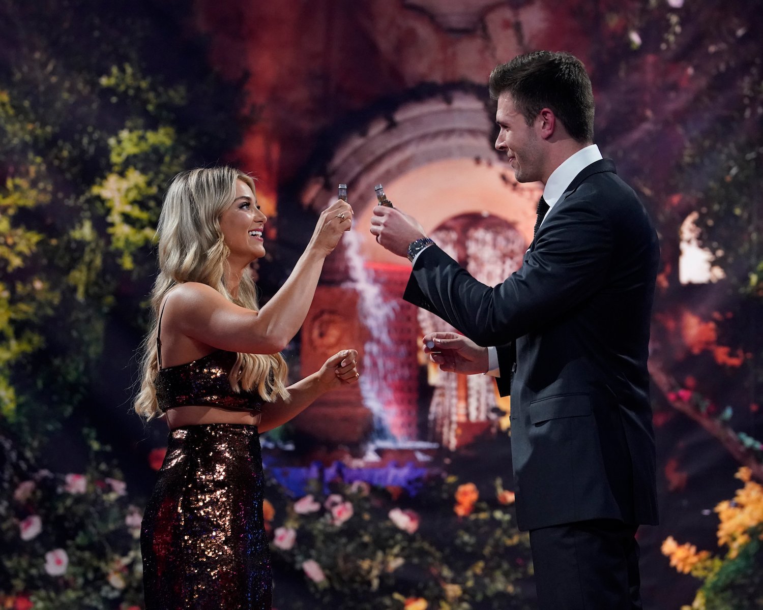 Christina Mandrell and Zach Shallcross on 'The Bachelor' Season 27 toasting with two mini bottles of Champagne