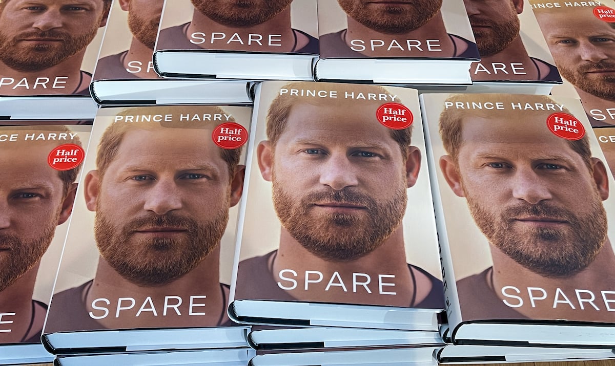 Copies of 'Spare', Prince Harry's memoir, which an expert says humanizes the royal family, are stacked on a table