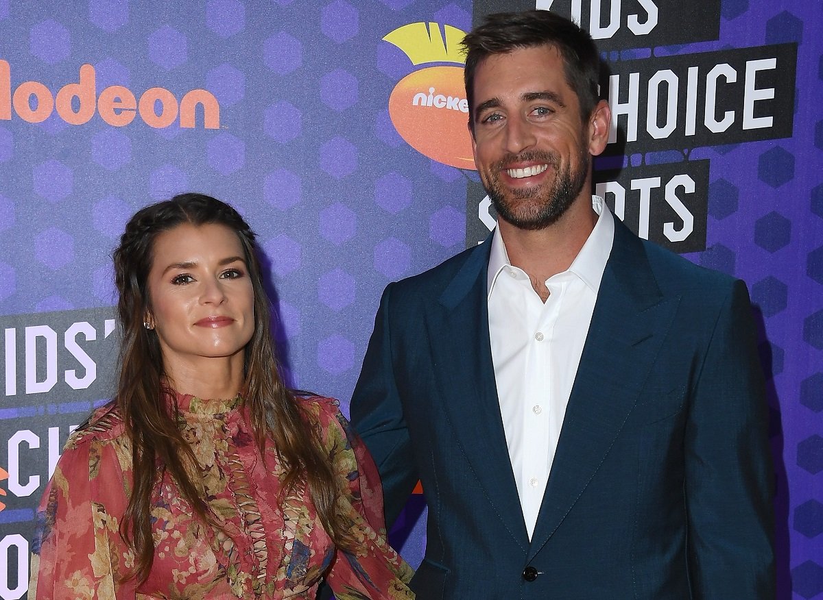 Danica Patrick and Aaron Rodgers attend the Nickelodeon Kids' Choice Sports Awards together in 2018