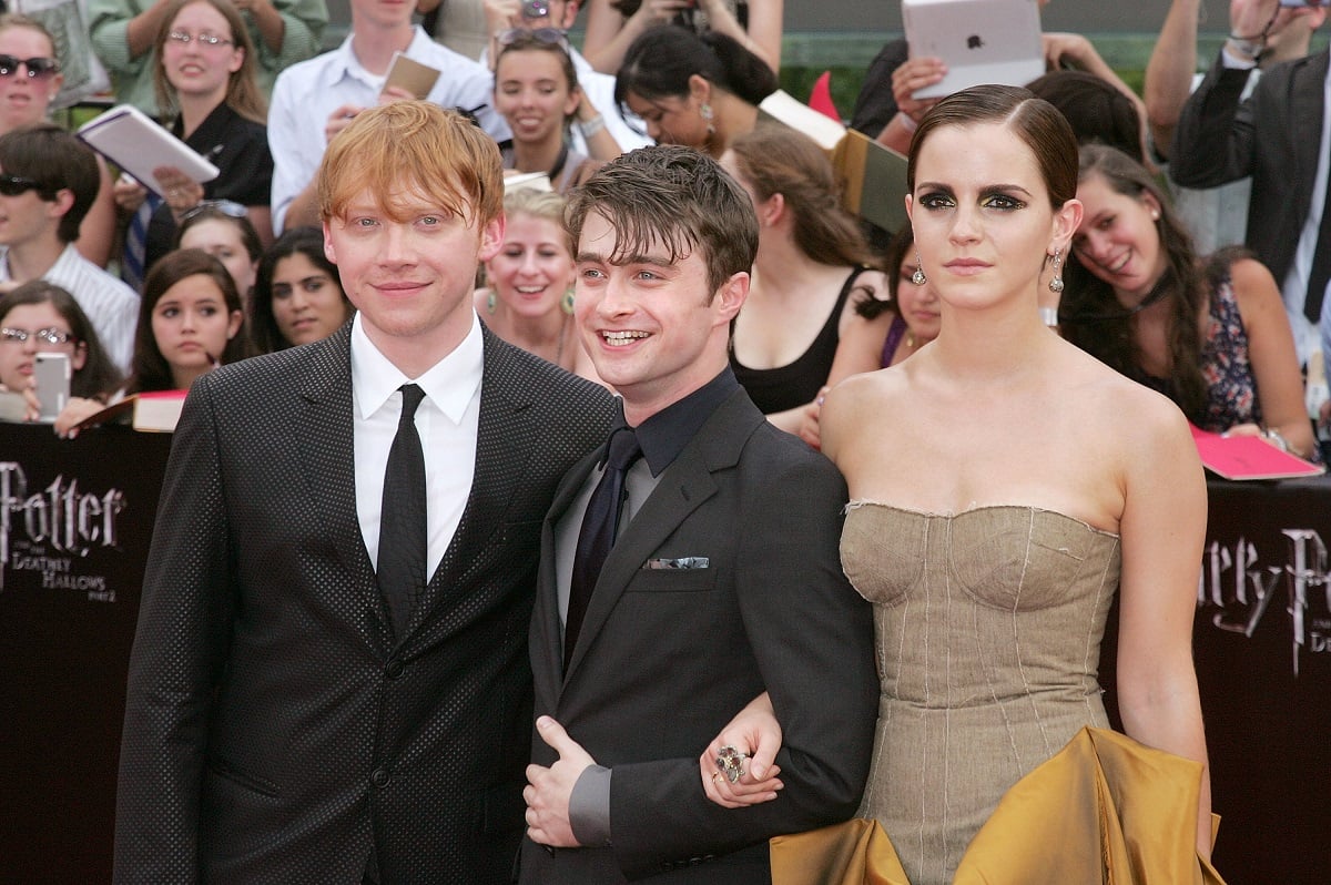 Daniel Radcliffe, Emma Watson, and Rupert Grint at 'The Deathly Hallows' premiere.