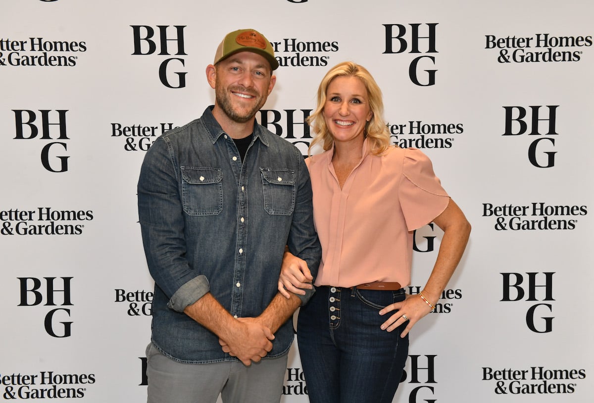 Dave Marrs and Jenny Marrs, who adopted daughter Sylvie, smile on the red carpet