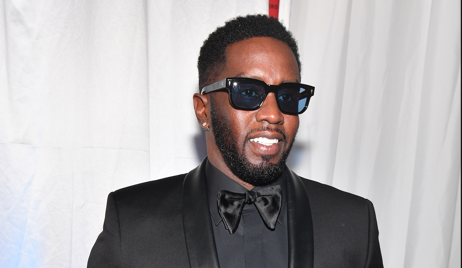 Sean "Diddy" Combs, who has a music catalog dating back over 2 decades, wearing a black tuxedo
