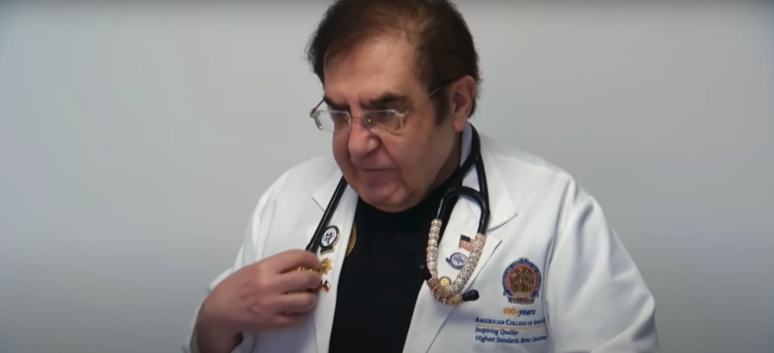 Dr. Now from 'My 600-lb Life' Season 11 on TLC with a stethoscope around his neck