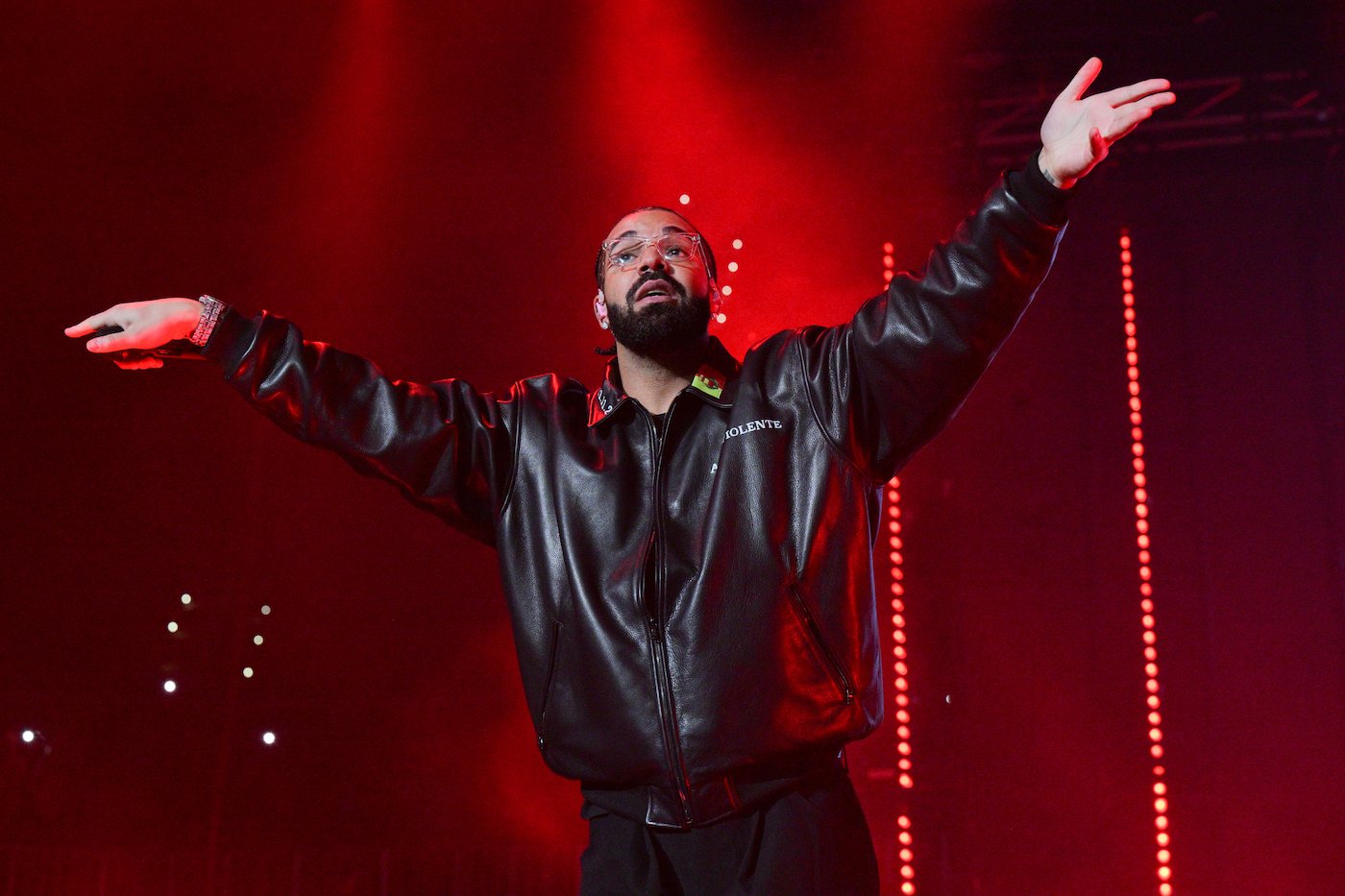 Drake, who teased a new album at his 2023 Apollo Theater show, on stage wearing a black leather jacket