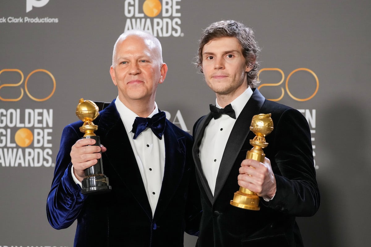 "American Horror Story" creator Ryan Murphy and actor Evan Peters pose together with Golden Globe Awards.