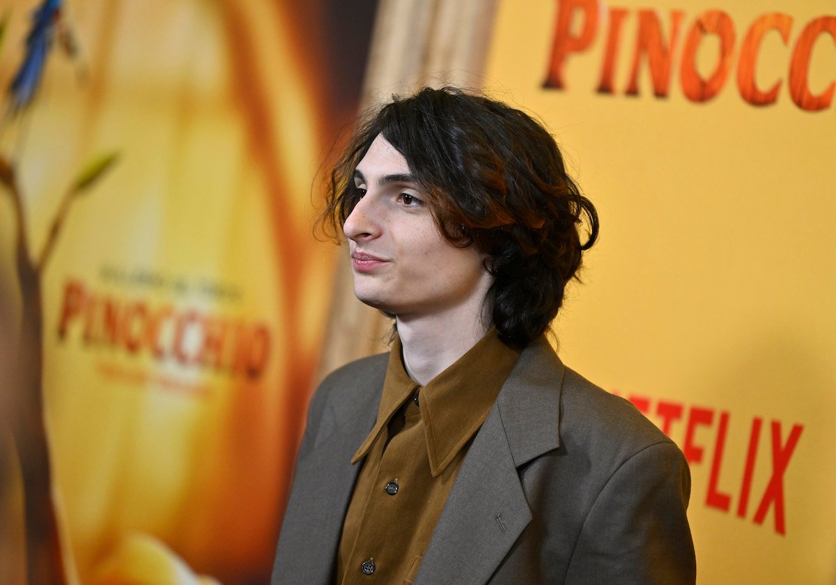 Finn Wolfhard poses for photos at the premiere of 'Guillermo Del Toro's Pinocchio'
