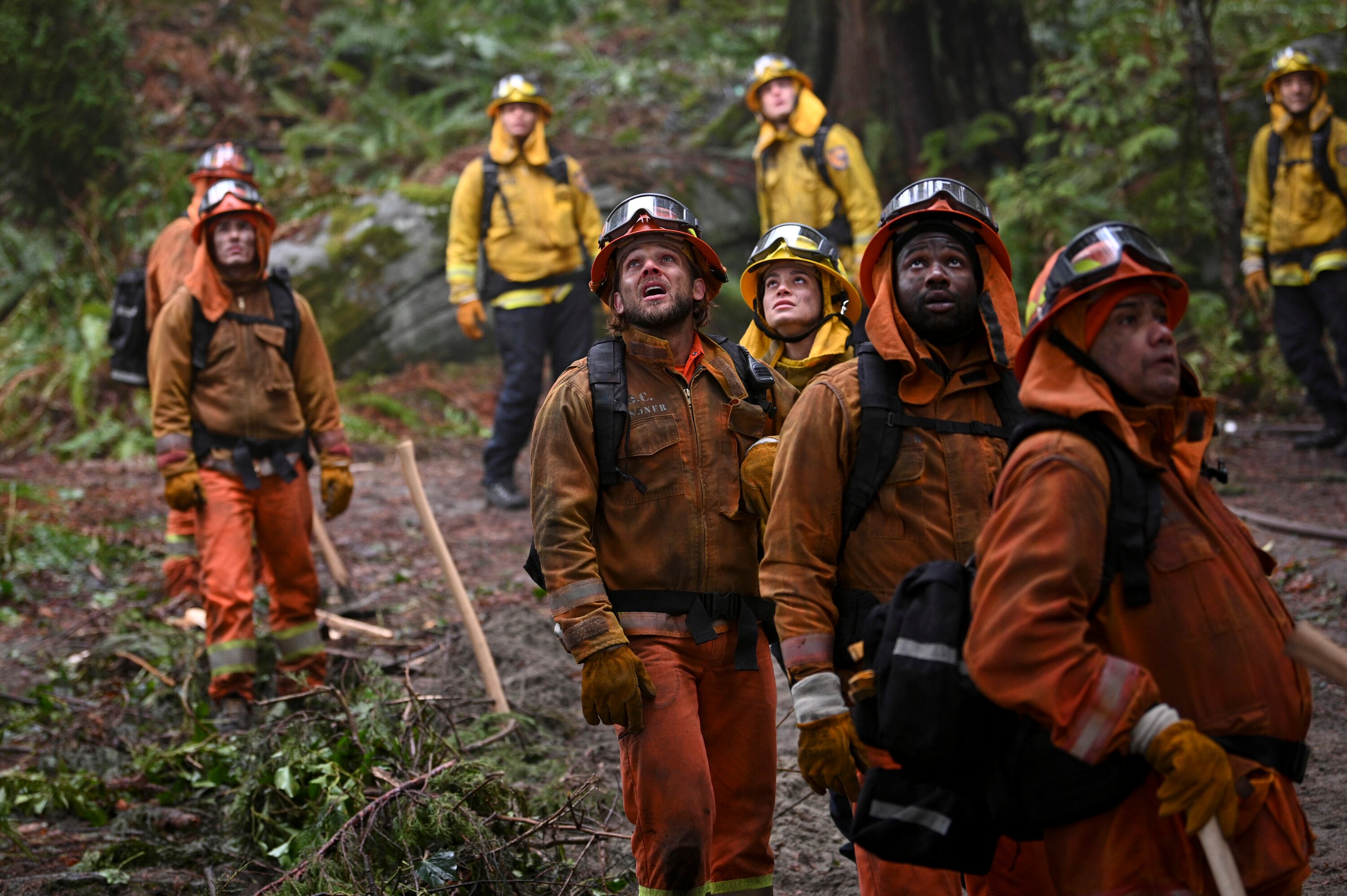 A group of firefighters look upward in the next new episode of 'Fire Country' on CBS, airing Jan. 29