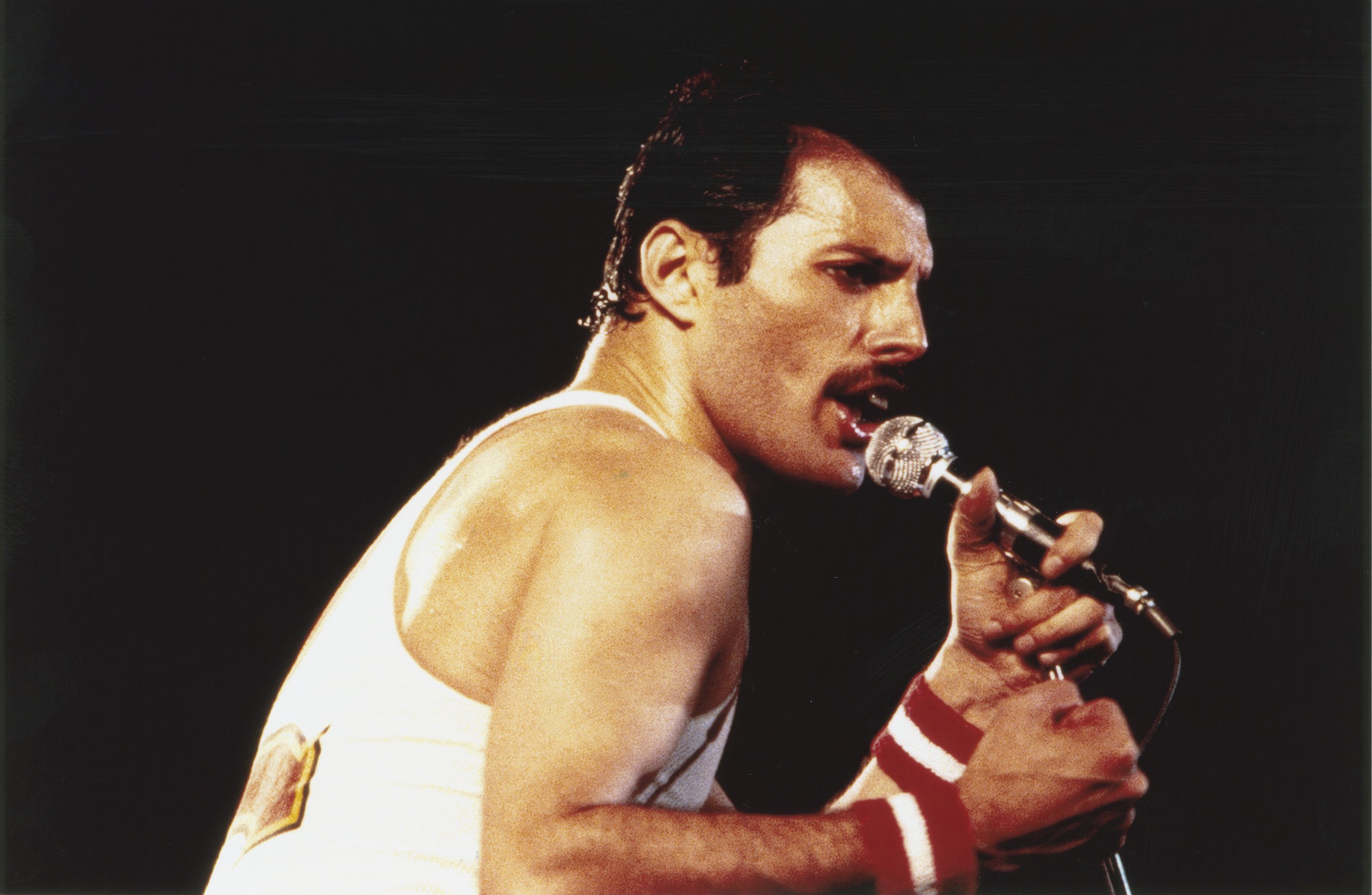 Freddie Mercury performs with Queen at the Milton Keynes National Bowl