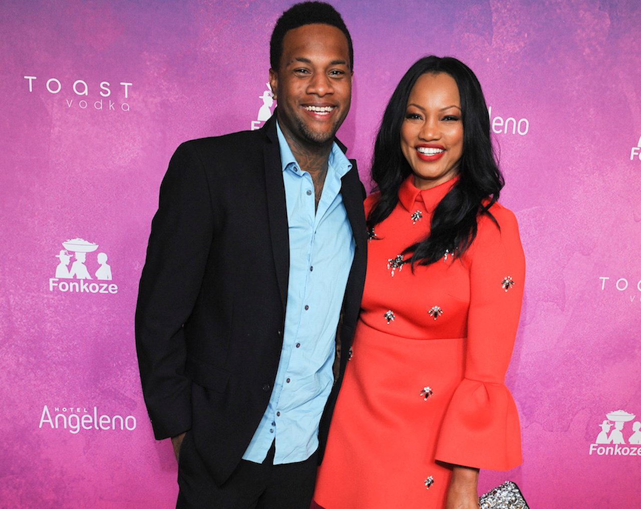 Garcelle Beauvais and her son Oliver pose and smile together on the red carpet