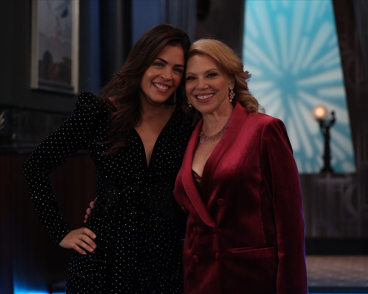 'General Hospital' star Kelly Thiebaud in a black dress and Kathleen Gati in a burgundy suit; pose together on set.