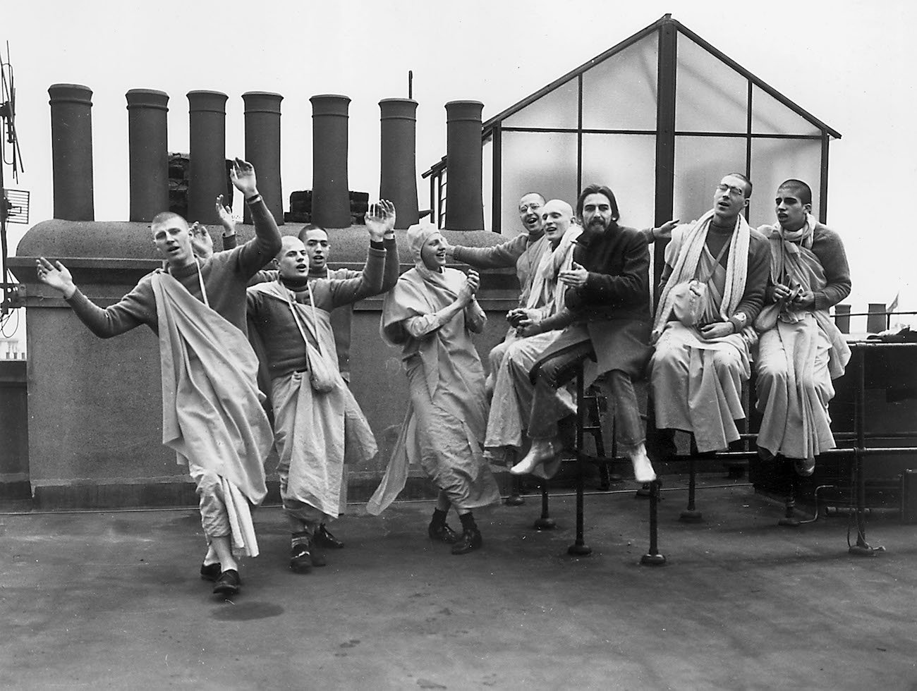 George Harrison and members of the Hare Krishna Temple on the rooftop of Apple Headquarters in 1970.