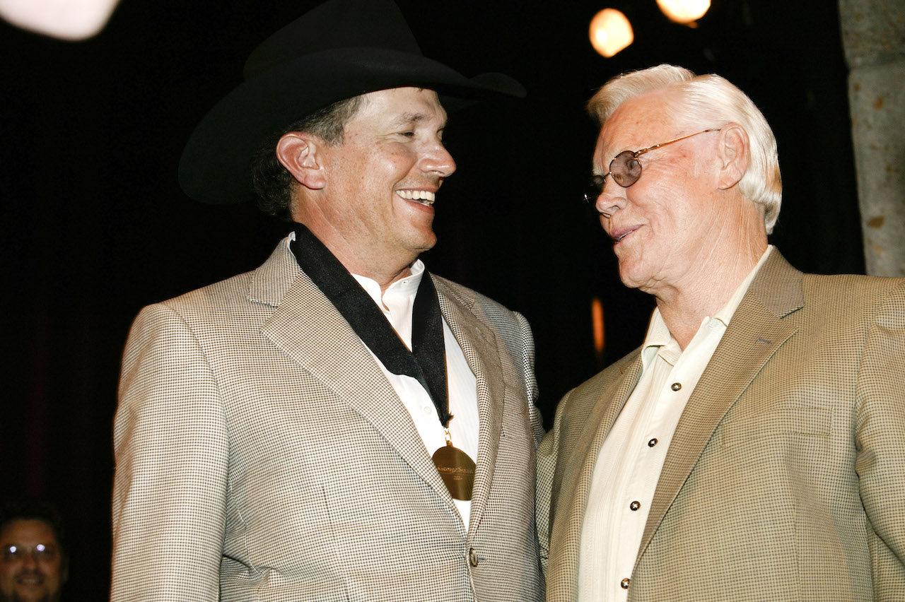 George Jones (right) presents George Strait with his medallion during the 2007 Country Music Hall of Fame Medallion Ceremony.
