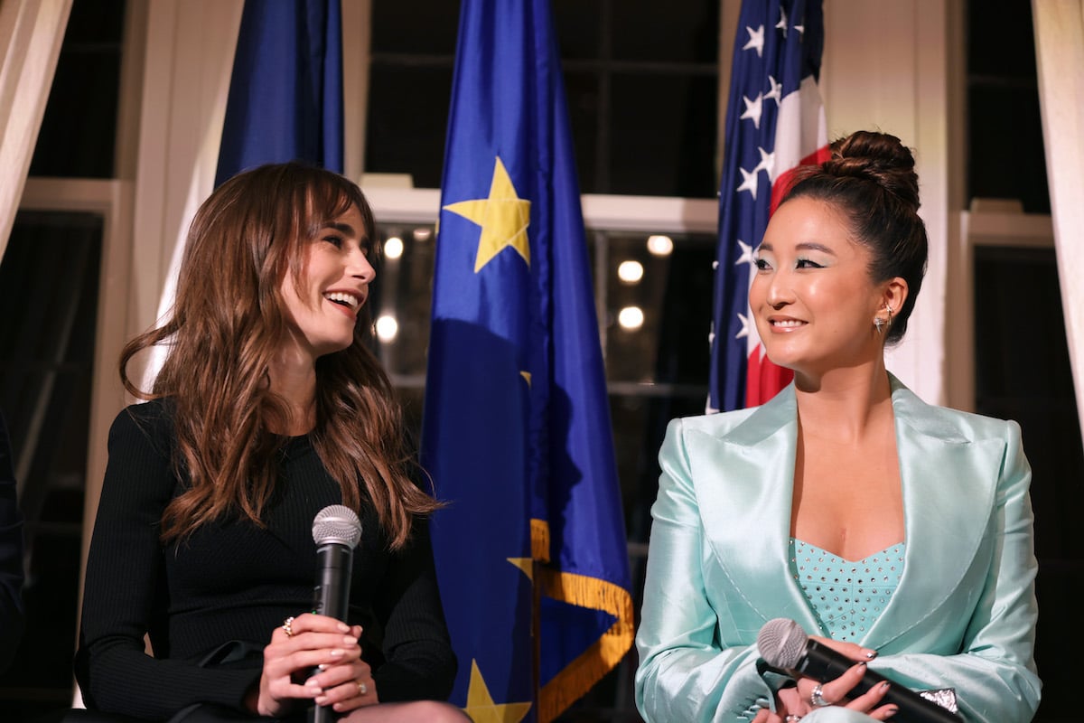 Lily Collins and Ashley Park speak during the Emily in Paris Season 2 celebration hosted by the French Ambassador
