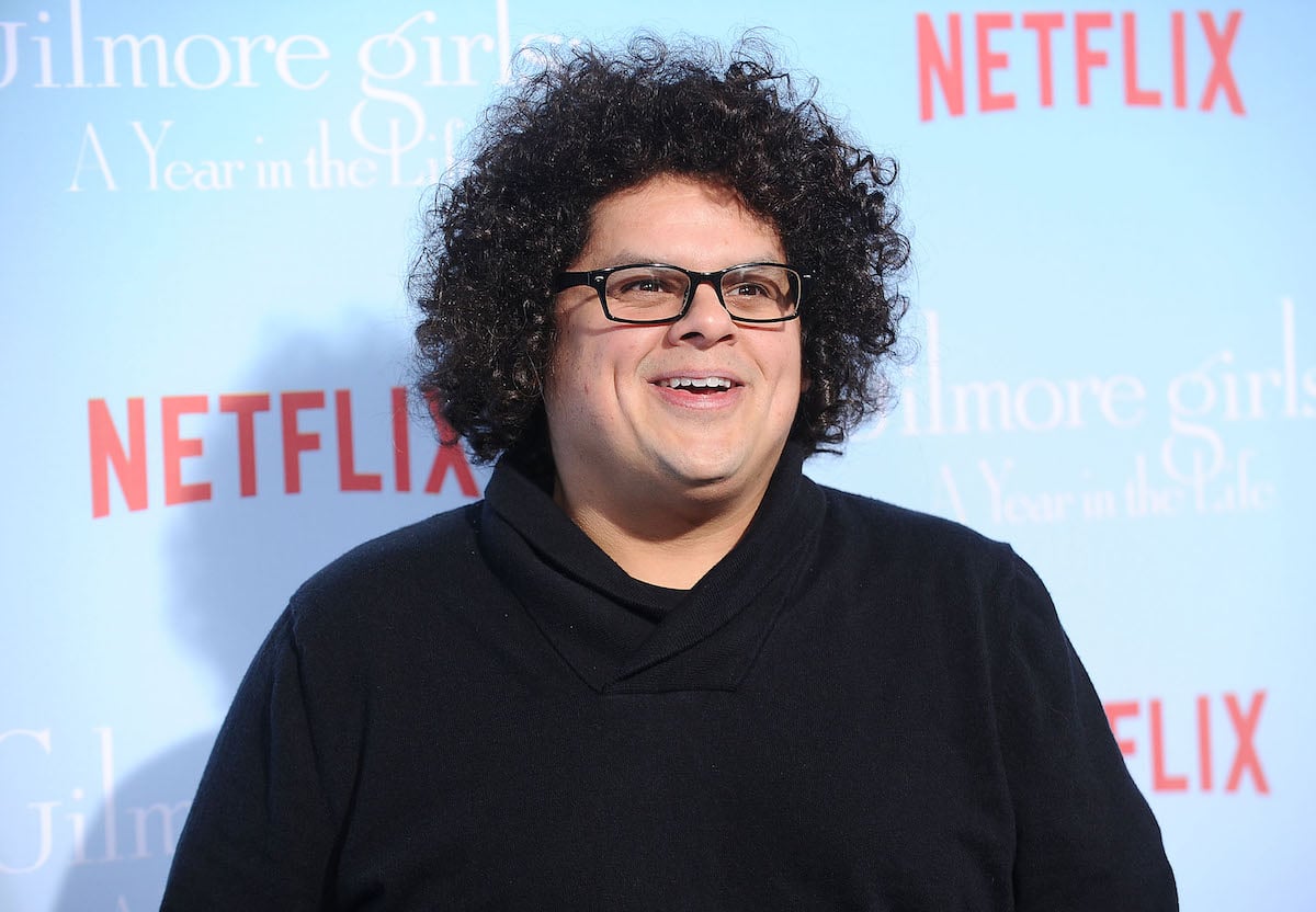 'Gilmore Girls' star Aris Alvarado smiles on the Netflix red carpet