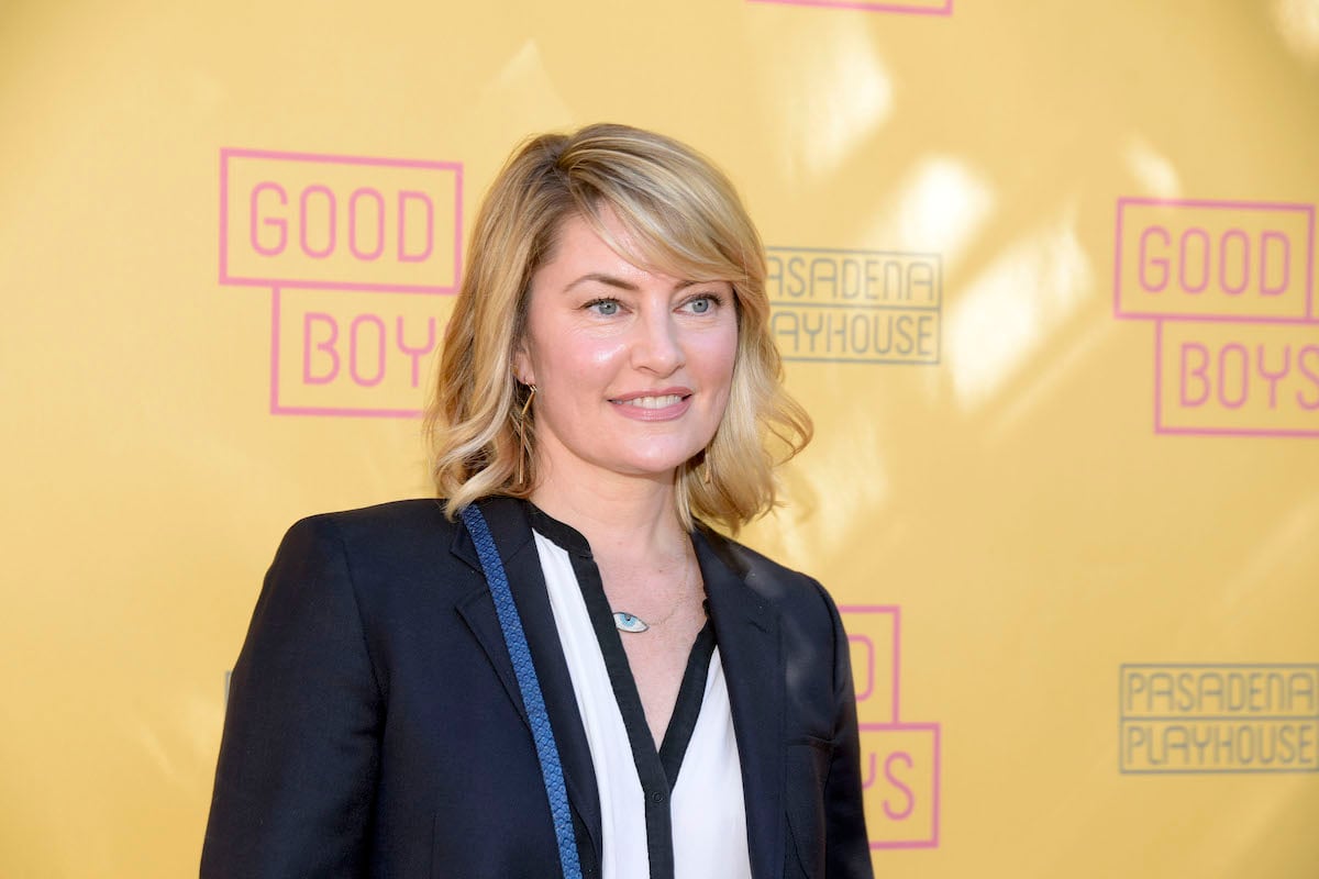 'Gilmore Girls' guest star Madchen Amick smiles on a red carpet