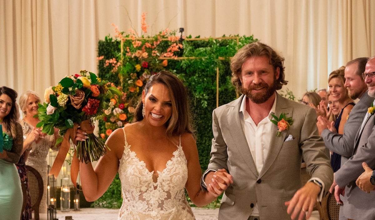 'Married at First Sight' Nashville cast members Gina and Clint walking down the aisle at their wedding