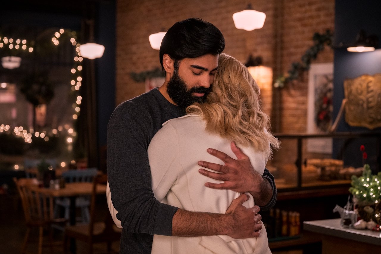 Raymond Ablack as Joe hugs Brianne Howey as Georgia in 'Ginny & Georgia'.