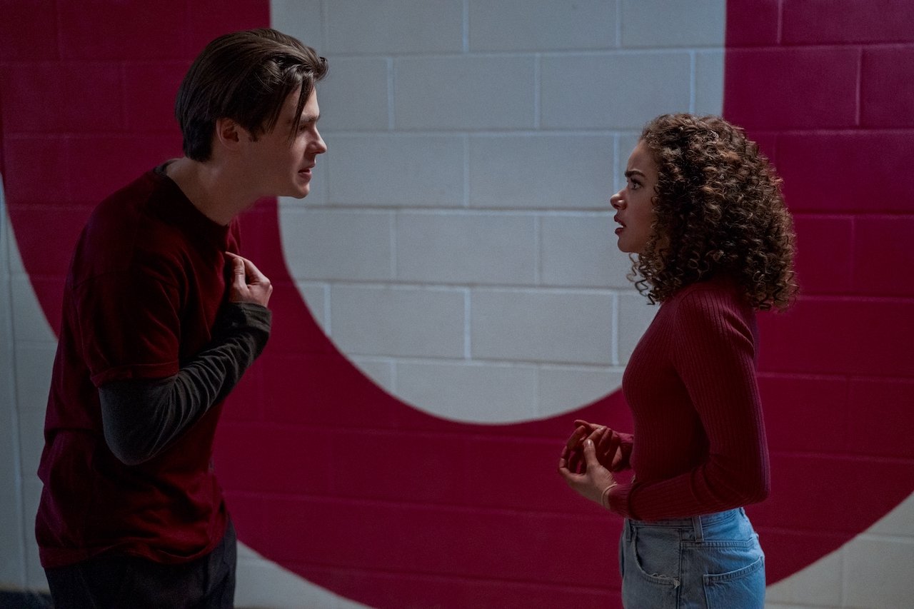 Felix Mallard as Marcus Baker and Antonia Gentry as Ginny talk in a hallway in 'Ginny & Georgia'.