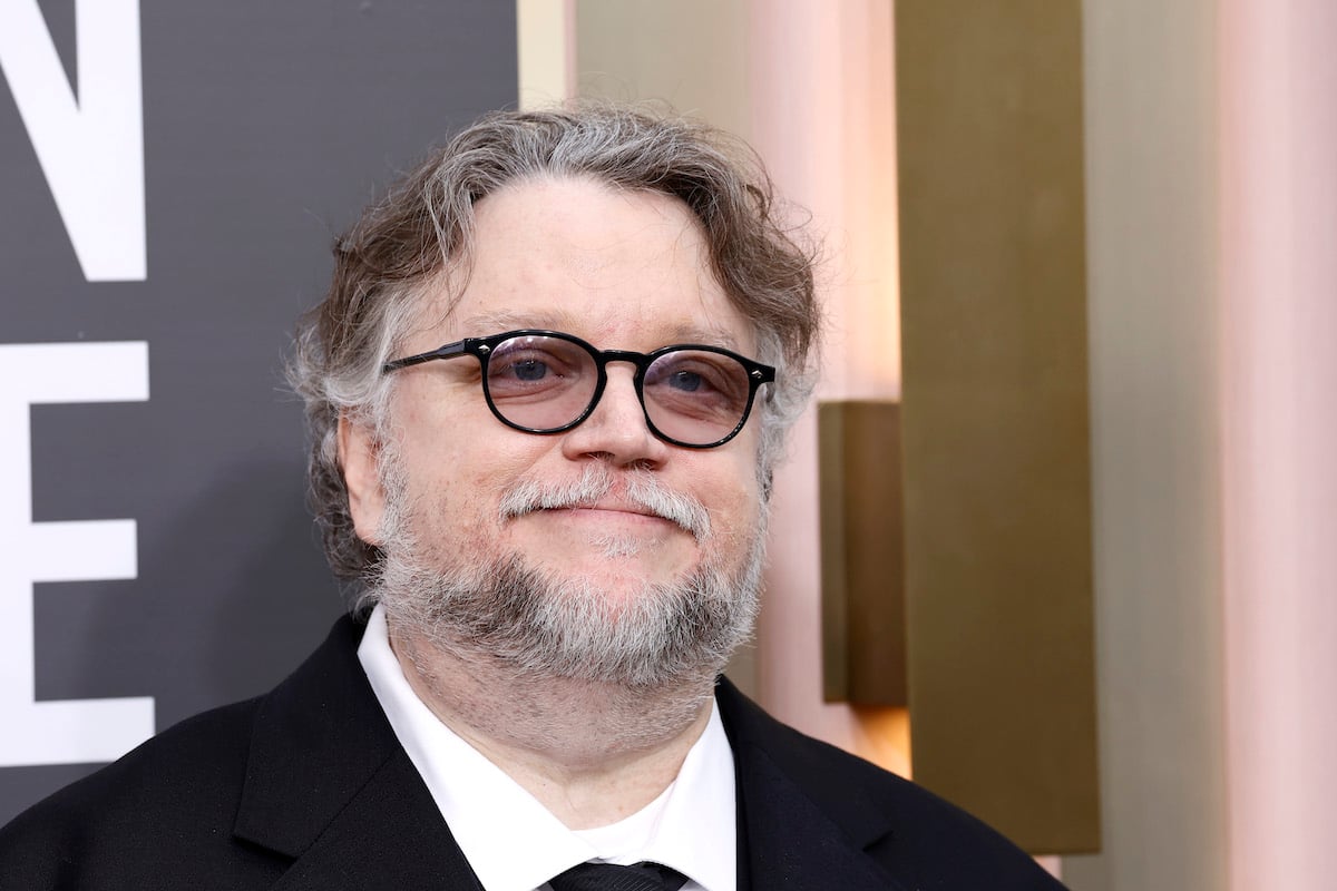 Guillermo del Toro poses for photos at the Golden Globe awards ceremony.
