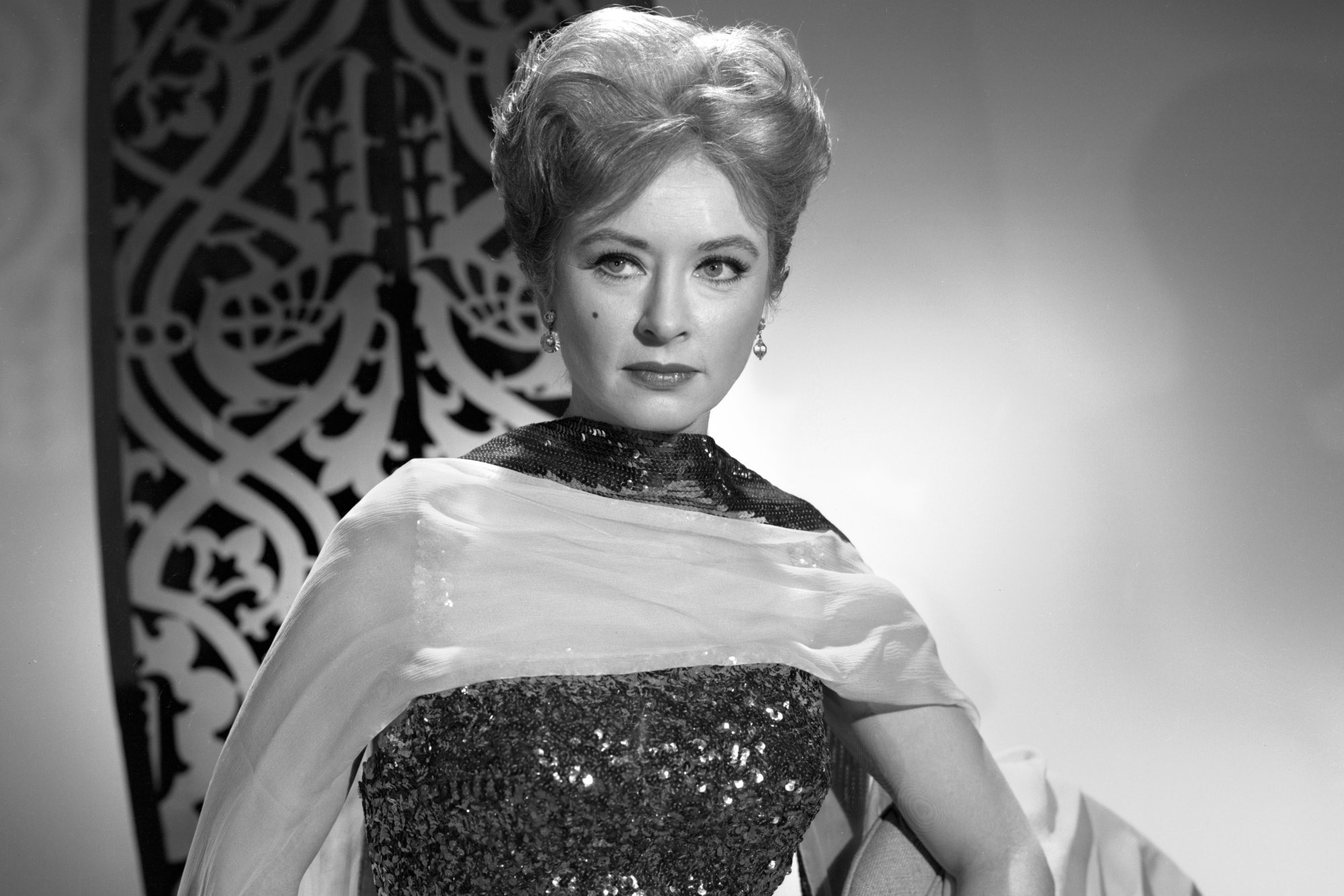'Gunsmoke' Amanda Blake as Miss Kitty Russell in a black-and-white promo picture looking off to the side