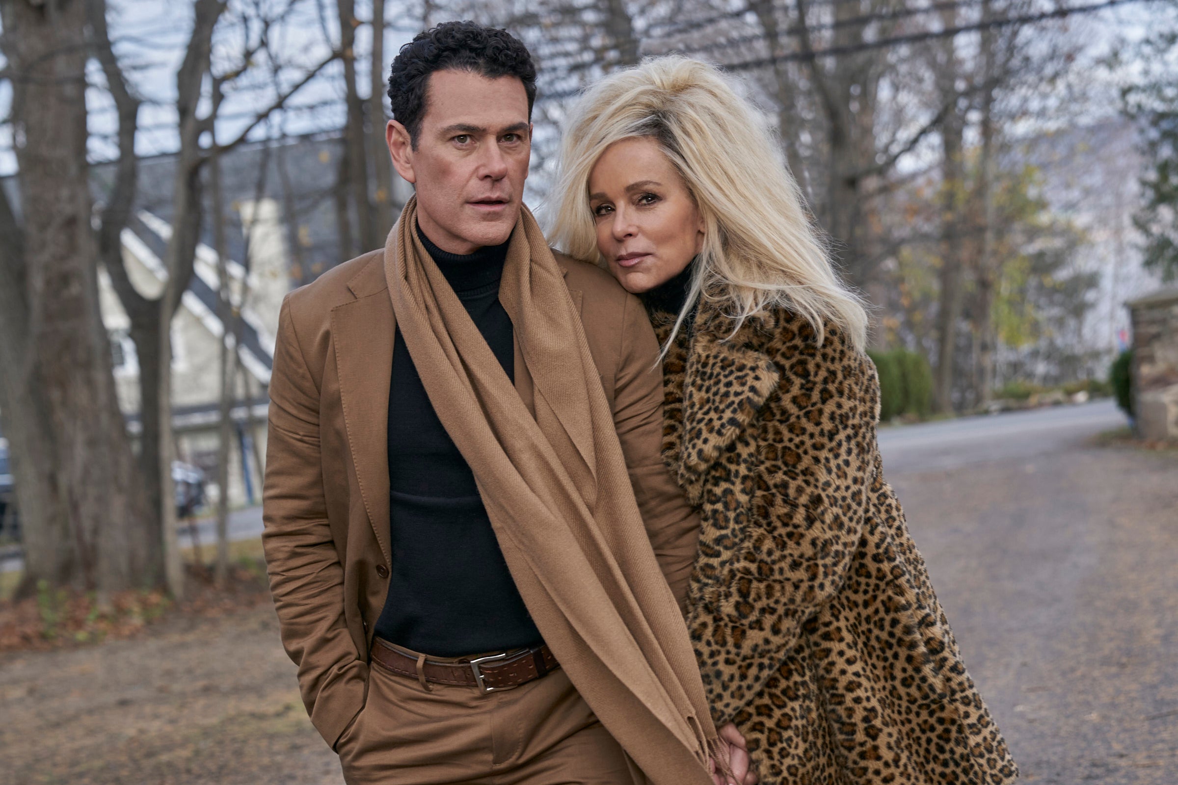 Vincent Walsh, wearing a brown jacket, and Jennifer Grey, wearing a leopard print coat, in the new Lifetime movie 'Gwen Shamblin: Starving for Salvation'